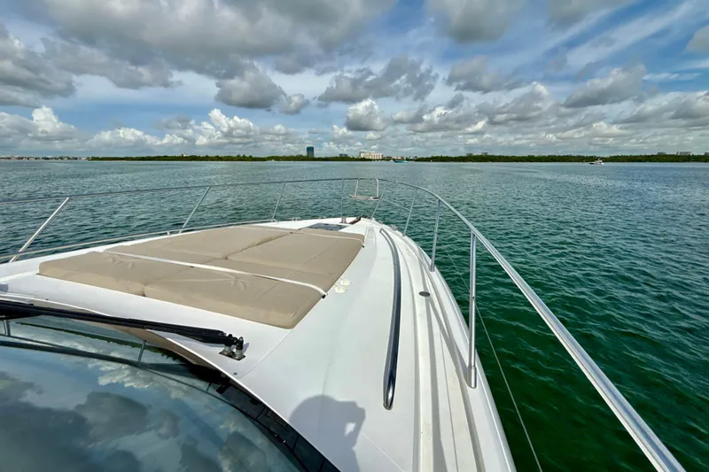 Il Capo Yacht Photos Pics 2017 Princess V58 yacht cruising on calm waters under a partly cloudy sky.
