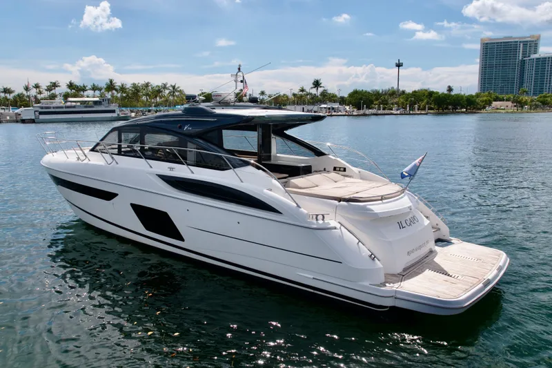 Il Capo Yacht Photos Pics Luxurious 2017 Princess V58 yacht docked in sunny marina, showcasing sleek design and elegance.