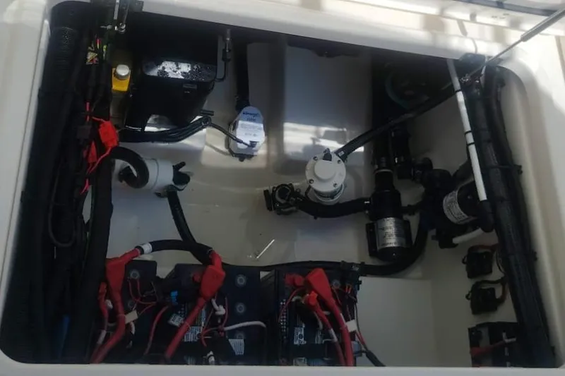  Yacht Photos Pics Engine compartment of 2024 Boston Whaler 280 Outrage, showcasing wiring and components.