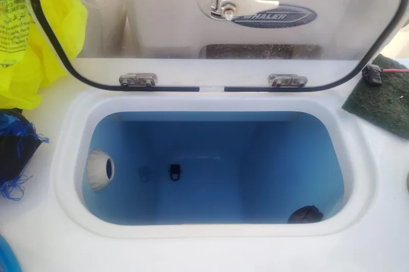  Yacht Photos Pics Open storage compartment on 2024 Boston Whaler 280 Outrage boat.