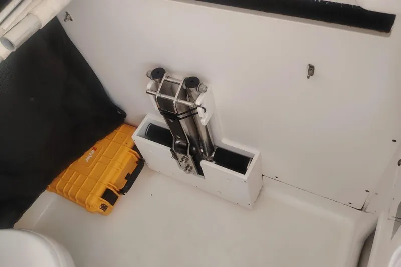  Yacht Photos Pics 2024 Boston Whaler 280 Outrage interior with ladder and yellow storage case.