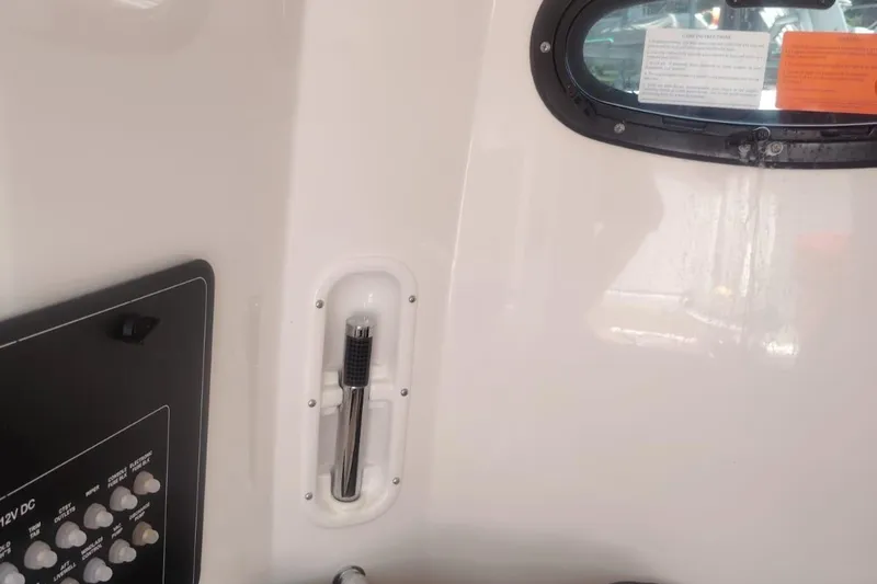  Yacht Photos Pics 2024 Boston Whaler 280 Outrage interior with control panel and window details.