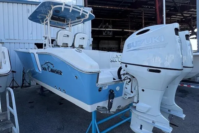  Yacht Photos Pics 2024 Sea Chaser 27 HFC CC boat with dual Suzuki outboard engines, docked in a marina.