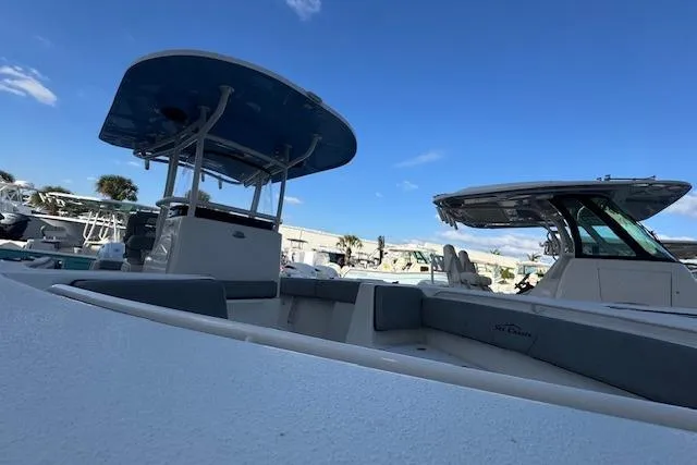  Yacht Photos Pics 2024 Sea Chaser 27 HFC CC boat under clear blue sky at marina.