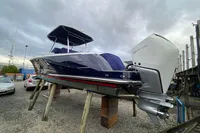 2021 Comitti Isola 33 boat with Mercury outboard engine on dry dock.