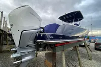 2021 Comitti Isola 33 boat with Mercury outboard engine on dry dock.