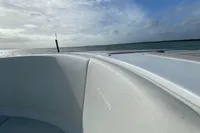 2021 Comitti Isola 33 boat interior with ocean view under a blue sky.