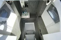 2021 Comitti Isola 33 interior with modern sink and sleek design.