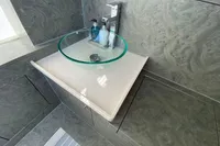 Modern bathroom sink with glass basin on Comitti Isola 33, 2021 model.