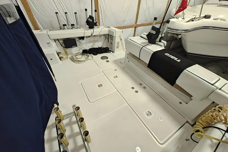 Got Fish Yacht Photos Pics 2005 Tiara Yachts 3200 Open cockpit with fishing rod holders and storage compartments.