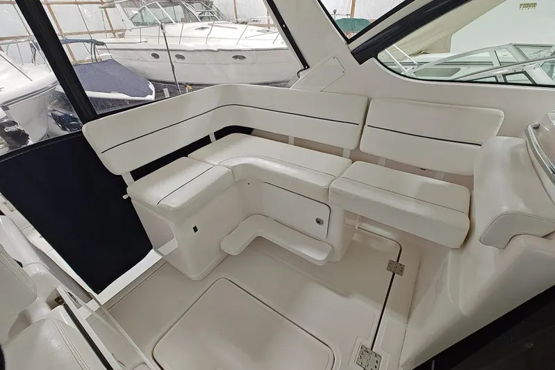 Got Fish Yacht Photos Pics 2005 Tiara Yachts 3200 Open interior with white seating and sleek design.