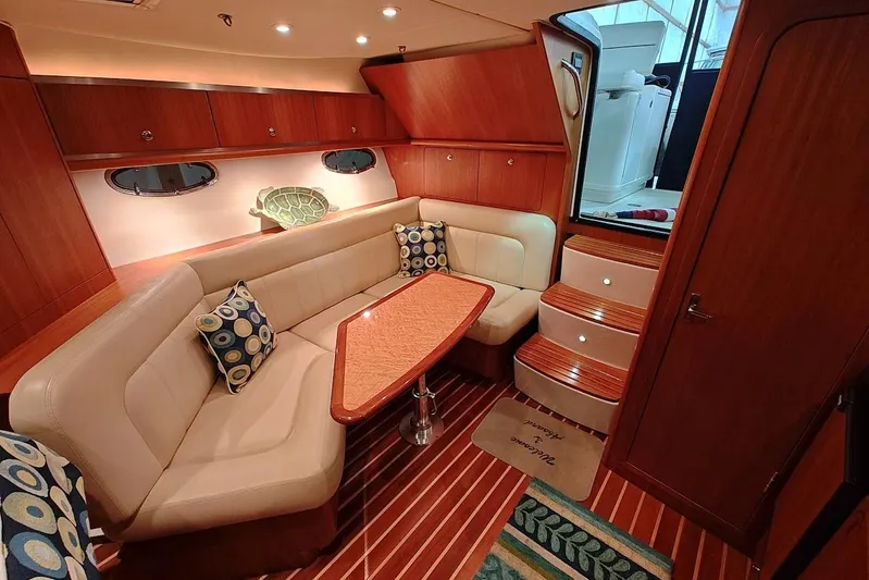 Got Fish Yacht Photos Pics Luxurious 2005 Tiara Yachts 3200 Open interior with elegant seating and wooden finishes.