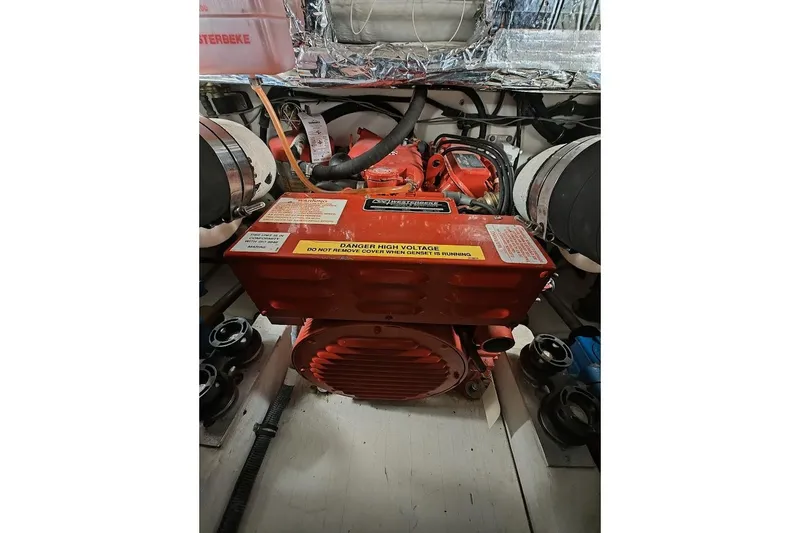 Got Fish Yacht Photos Pics Engine compartment of a 2005 Tiara Yachts 3200 Open, featuring a red Westerbeke generator.