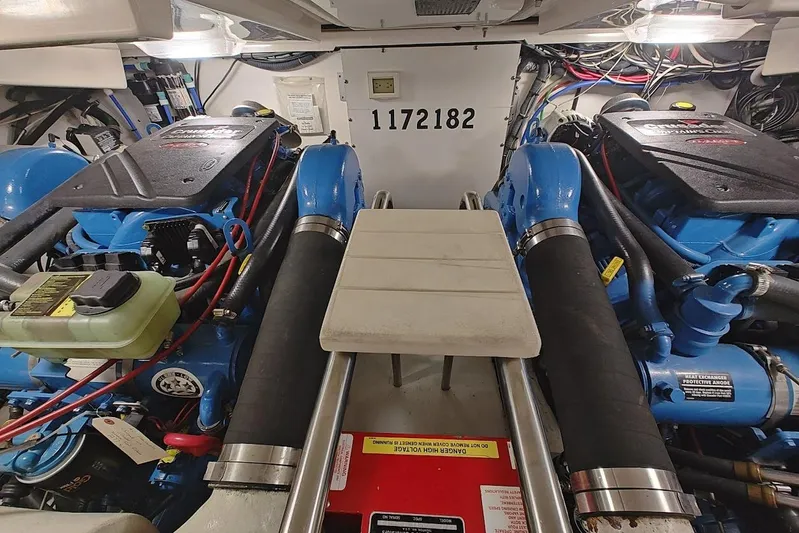 Got Fish Yacht Photos Pics Engine room of 2005 Tiara Yachts 3200 Open, featuring twin engines and detailed wiring.