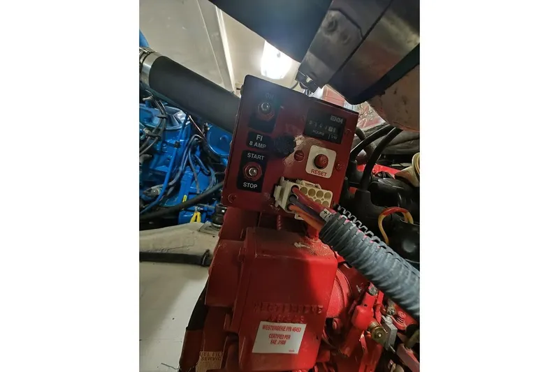 Got Fish Yacht Photos Pics Engine control panel of a 2005 Tiara Yachts 3200 Open, featuring start and stop buttons.