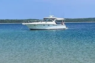 Got Fish Yacht Photos Pics 2005 Tiara Yachts 3200 Open on clear blue water, scenic background.