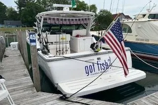 Got Fish Yacht Photos Pics 2005 Tiara Yachts 3200 Open docked, displaying American flag and "got fish?" sign.
