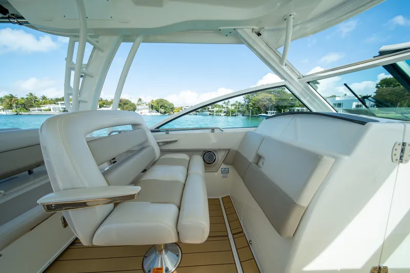  Yacht Photos Pics 2018 Boston Whaler 320 Vantage interior with luxurious seating and scenic water view.