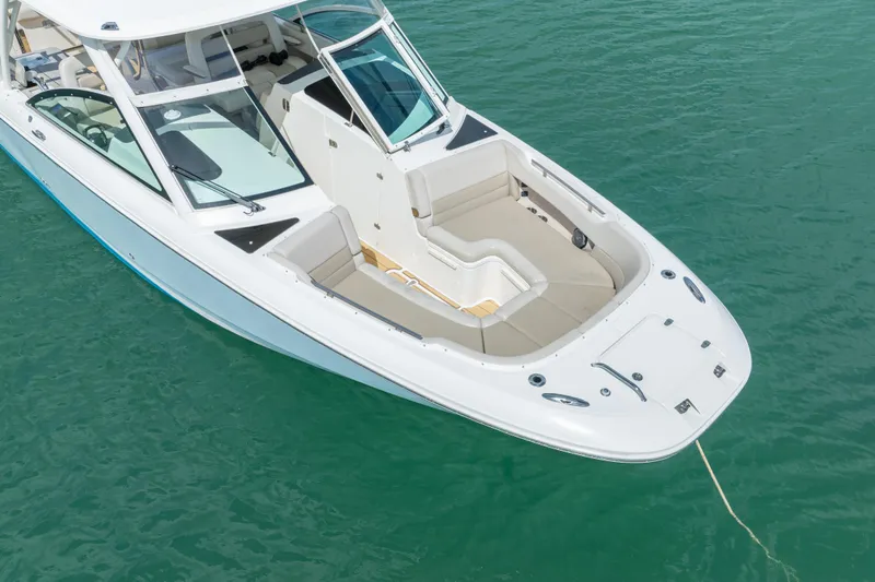  Yacht Photos Pics 2018 Boston Whaler 320 Vantage boat on clear turquoise water.