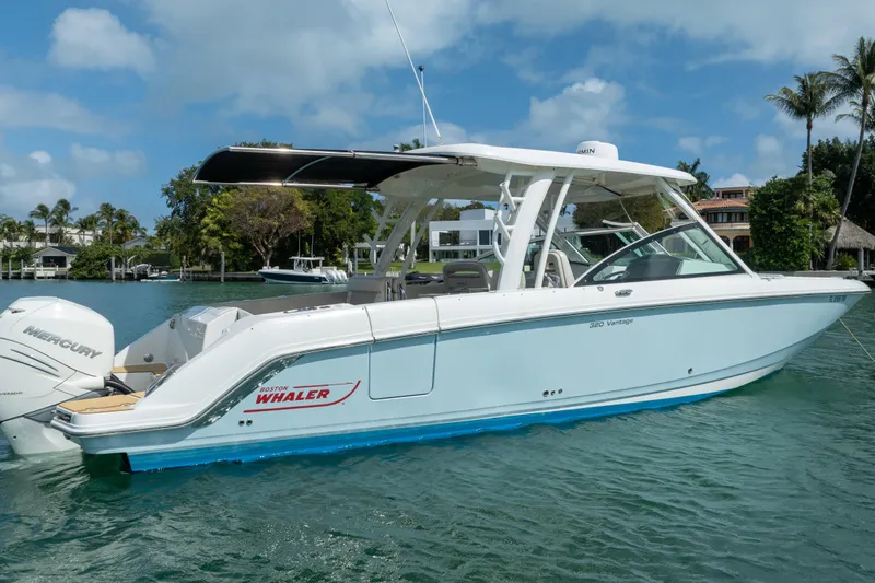  Yacht Photos Pics 2018 Boston Whaler 320 Vantage boat on water, clear sky, tropical background.