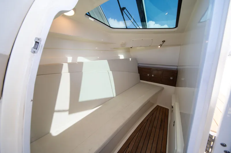  Yacht Photos Pics Interior cabin of 2018 Boston Whaler 320 Vantage with skylight and wooden flooring.