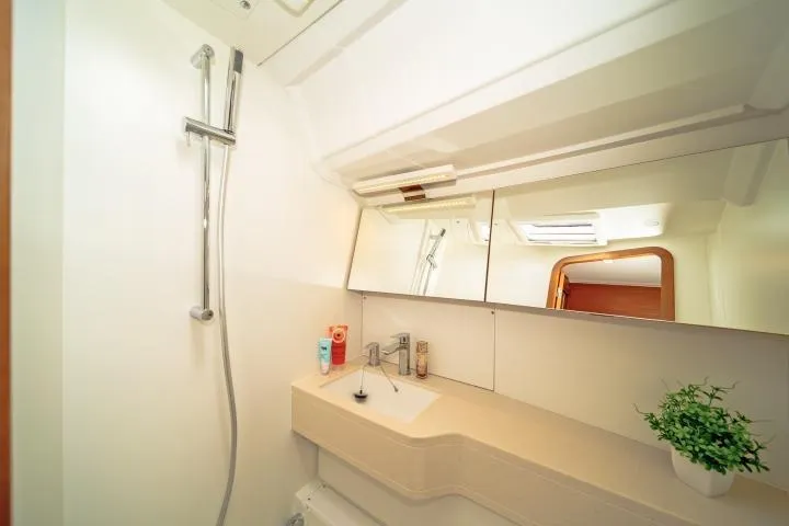One Heart Yacht Photos Pics Modern bathroom interior on 2025 Dufour 44 yacht, featuring sleek design and amenities.