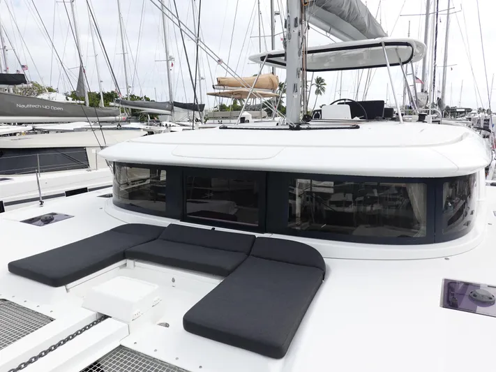 Clearlake III Yacht Photos Pics 2021 Lagoon 46 catamaran with sleek design, docked in a marina.