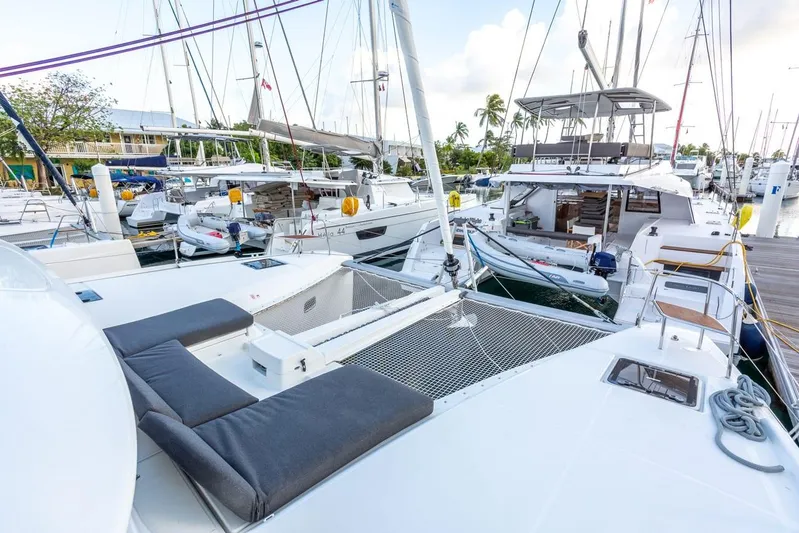 Clearlake III Yacht Photos Pics Lagoon 46 catamaran, 2021 model, docked in a marina with other boats.