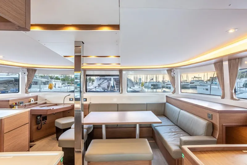 Clearlake III Yacht Photos Pics Luxurious interior of 2021 Lagoon 46 catamaran with modern seating and panoramic windows.