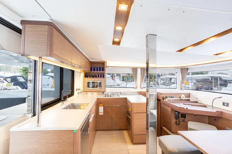 Clearlake III Yacht Photos Pics Modern interior of 2021 Lagoon 46 catamaran with spacious kitchen and dining area.