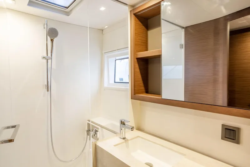 Clearlake III Yacht Photos Pics Modern bathroom interior in 2021 Lagoon 46 yacht, featuring sleek fixtures and wooden accents.