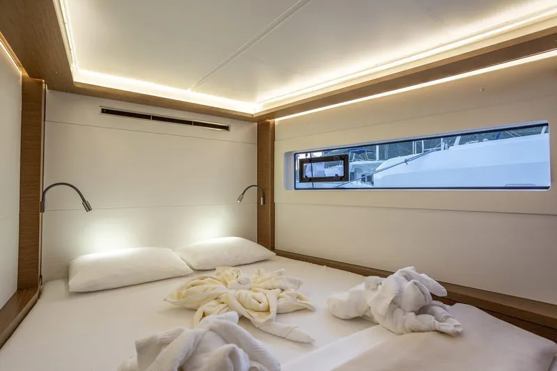 Clearlake III Yacht Photos Pics Luxurious cabin interior of 2021 Lagoon 46 yacht with modern lighting and window view.