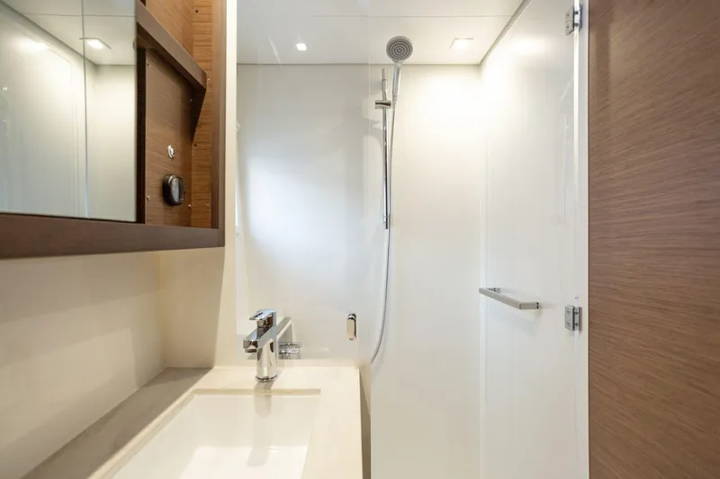 Clearlake III Yacht Photos Pics Modern bathroom interior of 2021 Lagoon 46 yacht with sleek shower and sink.