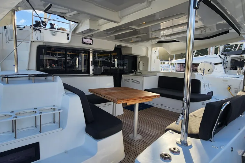 Clearlake III Yacht Photos Pics Spacious interior of 2021 Lagoon 46 catamaran with seating and dining area.