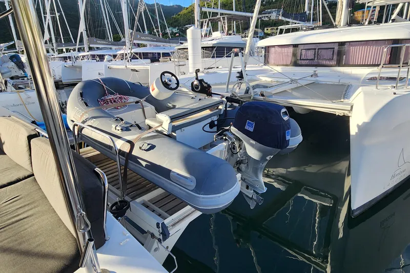 Clearlake III Yacht Photos Pics Inflatable dinghy on Lagoon 46 catamaran, 2021 model, docked at marina with other boats.
