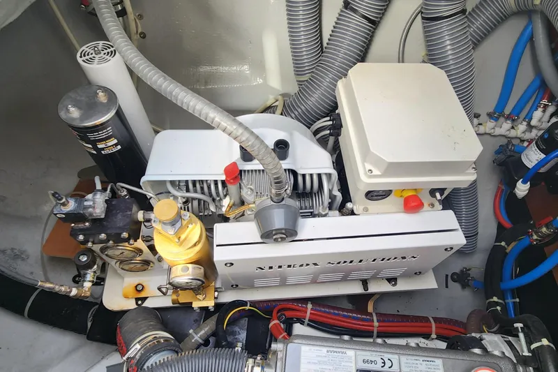 Clearlake III Yacht Photos Pics Engine room of a 2021 Lagoon 46 yacht, showcasing mechanical components and wiring.