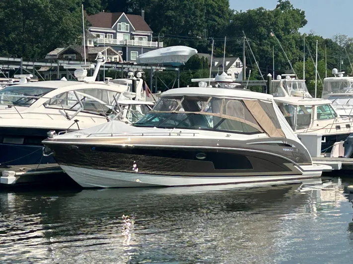  Yacht Photos Pics 2017 Formula 350 CBR boat docked in a marina, surrounded by other vessels.