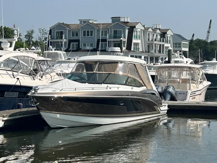  Yacht Photos Pics 2017 Formula 350 CBR boat docked at marina with waterfront buildings in background.