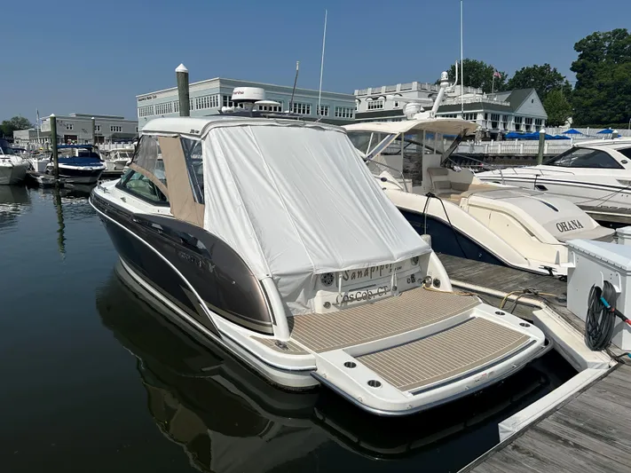  Yacht Photos Pics 2017 Formula 350 CBR boat docked at marina, covered, with nearby yachts.