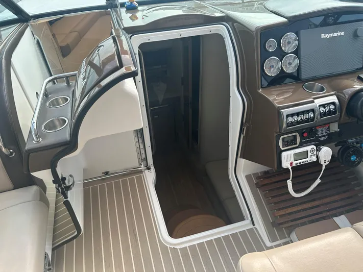  Yacht Photos Pics 2017 Formula 350 CBR boat cockpit with open cabin door and control panel.