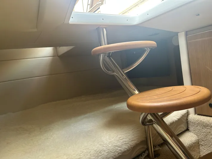  Yacht Photos Pics Interior view of 2017 Formula 350 CBR boat with wooden steps and cozy cabin space.