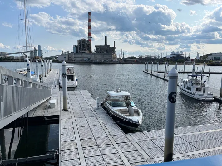  Yacht Photos Pics Docked 2017 Formula 350 CBR boat at marina with industrial backdrop and cloudy sky.