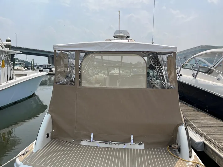  Yacht Photos Pics 2017 Formula 350 CBR boat docked with protective cover, marina background.