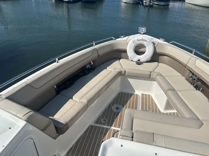  Yacht Photos Pics 2017 Formula 350 CBR boat with spacious seating and life preserver on deck.