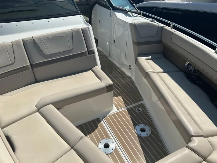  Yacht Photos Pics 2017 Formula 350 CBR boat interior with beige seating and wood-patterned flooring.