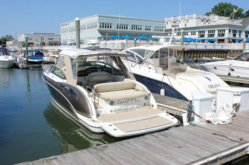  Yacht Photos Pics 2017 Formula 350 CBR boat docked at a marina, surrounded by other boats.