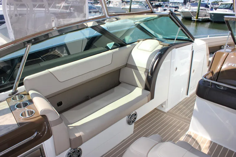  Yacht Photos Pics 2017 Formula 350 CBR boat interior with beige seating and cup holders, docked at marina.