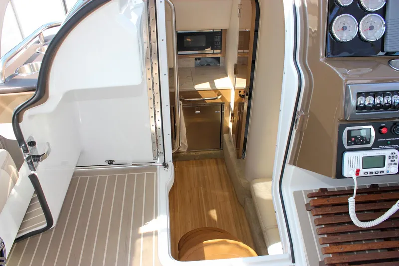  Yacht Photos Pics 2017 Formula 350 CBR boat interior with control panel, kitchenette, and seating area.