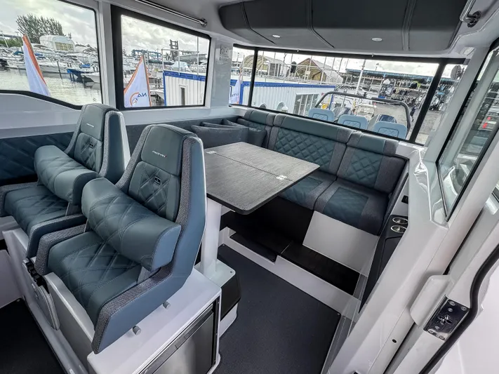  Yacht Photos Pics Luxurious interior of 2024 Axopar 37XC CROSS CABIN with plush seating and modern design.