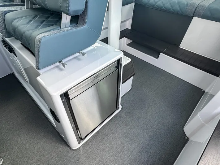  Yacht Photos Pics 2024 Axopar 37XC CROSS CABIN interior with seating and built-in storage.